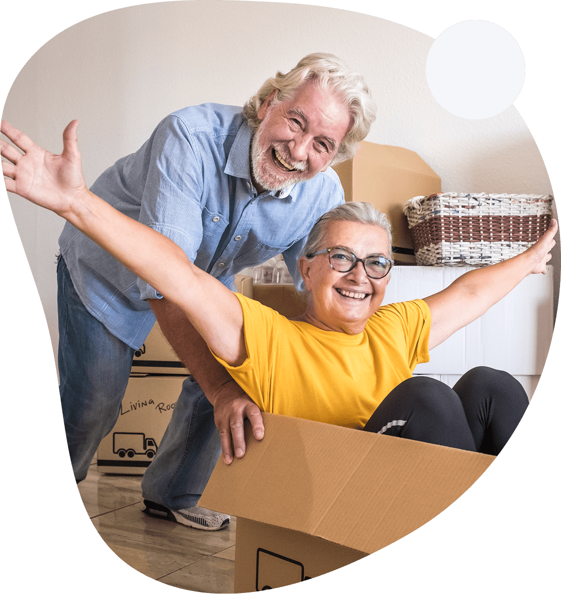 5 A man and woman in the middle of moving boxes.
